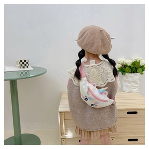 Kid's unicorn waist bag with rainbow sequins and adjustable pink strap worn by a child
