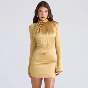 Detail showing the elegant gold satin fabric texture and ruched design of the mini dress