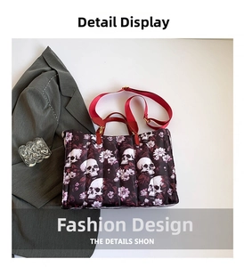 Detail of gothic tote bag with skull floral print and vibrant red shoulder straps