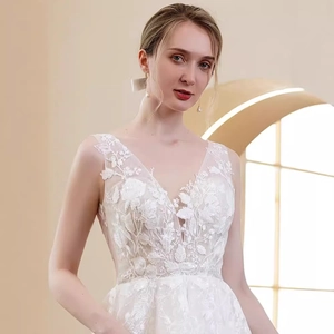 Lace V-neck sleeveless white wedding dress with floral embroidery and mesh detail