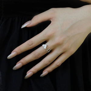 Close-up of S925 sterling silver adjustable open ring with sparkling heart shaped zircon