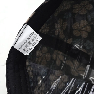 Macro detail of 100% polyester fabric lining and stitch quality of the flower baseball cap