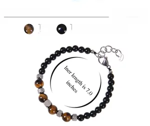 Detail of tiger eye and obsidian beaded bracelet with stainless steel lobster clasp and chain
