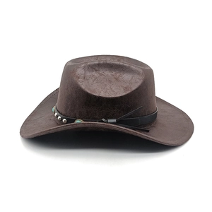 Detailed texture of dark brown vintage faux leather cowboy hat with turquoise studs