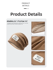 Detail view of tan knitted beanie featuring dual-layer fabric and vintage cloth label