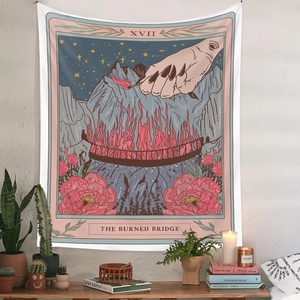 Bohemian tarot tapestry featuring The Burned Bridge design displayed on a white wall