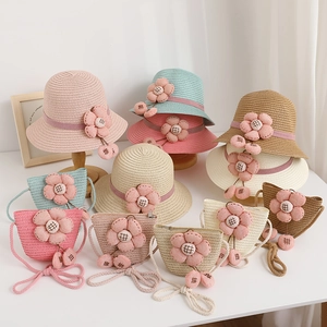 Kids summer wide brim straw hat and matching bag set with large fabric flower details