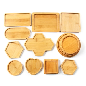 Assorted geometric bamboo trays in various shapes and sizes on white background