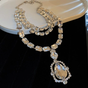 Luxurious layered silver necklace with rectangular crystals and water drop pendant
