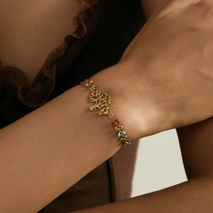 Golden Tree of Life bracelet for women with colorful beads on a delicate chain link