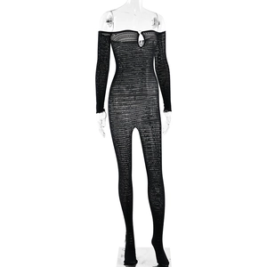 Detail of black hollow mesh bodysuit with off-the-shoulder design and long sleeves