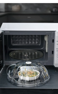 Macro shot of 360-degree oil-proof microwave splatter cover with circular ring handle
