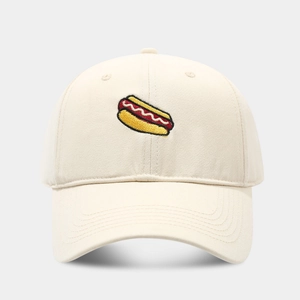 Close-up of hot dog embroidery on a beige cotton baseball cap with high-density stitching