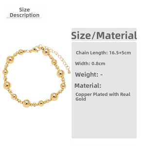 Detail view of 18k gold plated bead bracelet with adjustable chain and lobster clasp