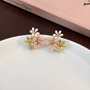 Gold-plated daisy flower stud earrings with zircon and pink enamel floral accents