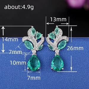 Elegant emerald green teardrop earrings with silver setting and size dimensions 26mm x 13mm