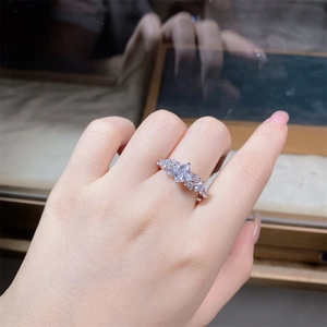 Close-up of elegant V-shaped 925 silver ring with square-cut cubic zirconia on finger
