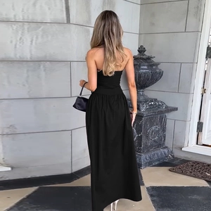 Detail view of black tube top maxi dress showing slim fit back and long floor-length hem