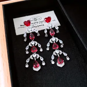 Elegant vintage silver tassel earrings with red heart stones and sparkling cubic zirconia