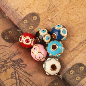 Colorful evil eye beads in multiple shades with golden metal rims for DIY jewelry making