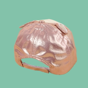 Detail of rose gold kids baseball cap featuring cute rabbit ears and adjustable velcro strap