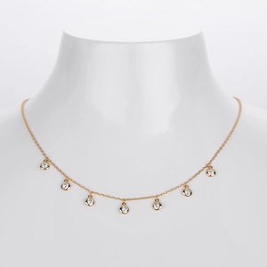 Elegant gold plated S925 sterling silver necklace with seven sparkling zircon stones on a model