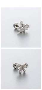 Close-up of titanium steel fan and bow stud earrings with inlaid cubic zirconia