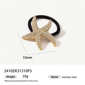 Detail view of a 53mm starfish hair tie with white rhinestones and a black elastic band