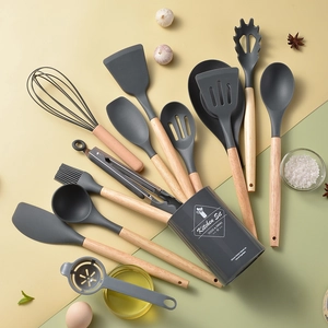 11-piece silicone kitchen utensil set with wooden handles and gray storage bucket