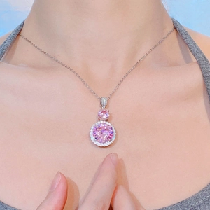 Close-up of elegant pink zircon pendant necklace featuring a brilliant round halo design
