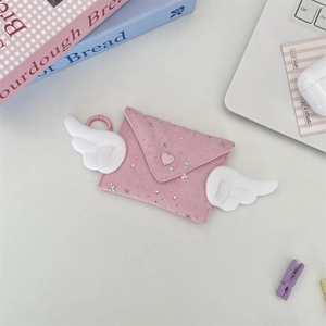 Close-up of pink envelope mini pouch with white plush wings and heart button detail