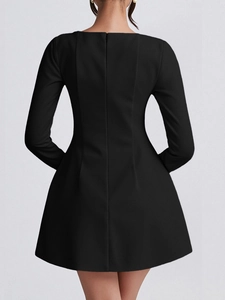 Back view of elegant black long sleeve dress with waist slimming fit and A-line silhouette