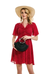 Red polka dot dress paired with a black semi-circle hollow bamboo tote bag for summer