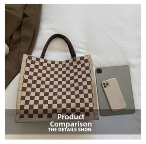 Detail of checkered canvas tote bag next to a tablet and phone for size comparison