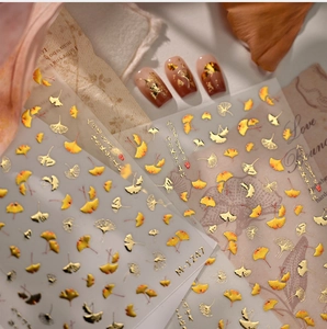 Macro detail of M-1247 autumn ginkgo leaf nail stickers with gold foil calligraphy