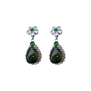 Luxury earrings with green teardrop zircon and white flower crystals in metal setting