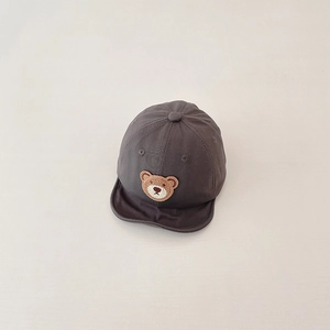 Detail of baby baseball cap with bear embroidery patch and breathable air holes