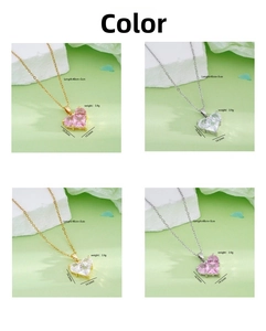 Detailed views of 18K gold plated heart pendants with pink and clear crystals