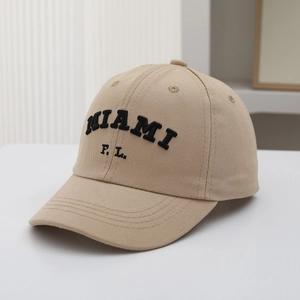 Close-up of khaki cotton baseball cap with black MIAMI F.L. 3D embroidery and twill texture
