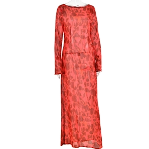 Detailed view of red bohemian floral print sheer mesh fabric on long sleeve dress