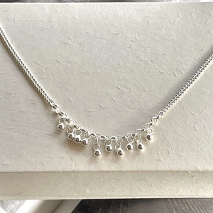 Elegant 925 sterling silver beaded bracelet with minimalist round charms on a delicate chain