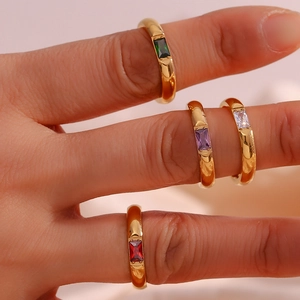 Detail of 18K gold-plated stainless steel rings with colorful rectangular zircon stones