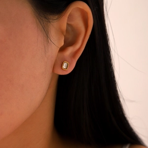 Chic gold stainless steel square zircon stud earring on female model ear