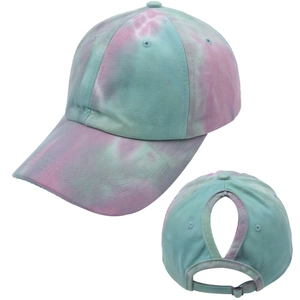 Detail view of tie-dye ponytail baseball cap with U-shaped cutout and metal buckle
