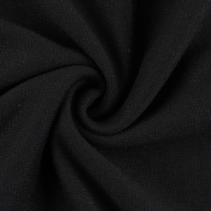 Macro shot of black knitted fabric texture showing soft spiral folds and fine weaving