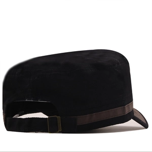 Close-up of adjustable bronze metal buckle on a black cotton military style flat top cap