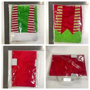 Detail view of red and green Christmas elf chair covers on weight scale for quality control