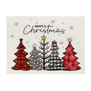 Christmas table mat featuring five decorative trees and Merry Christmas text on white background