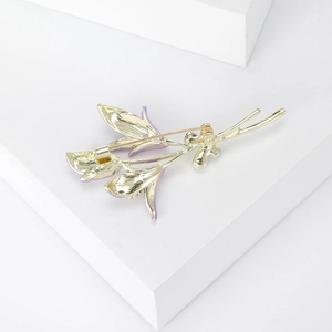 Detailed back view of the vintage purple enamel flower brooch with gold plating