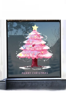 Detail of pink Christmas tree window sticker with Merry Christmas text for shop decor